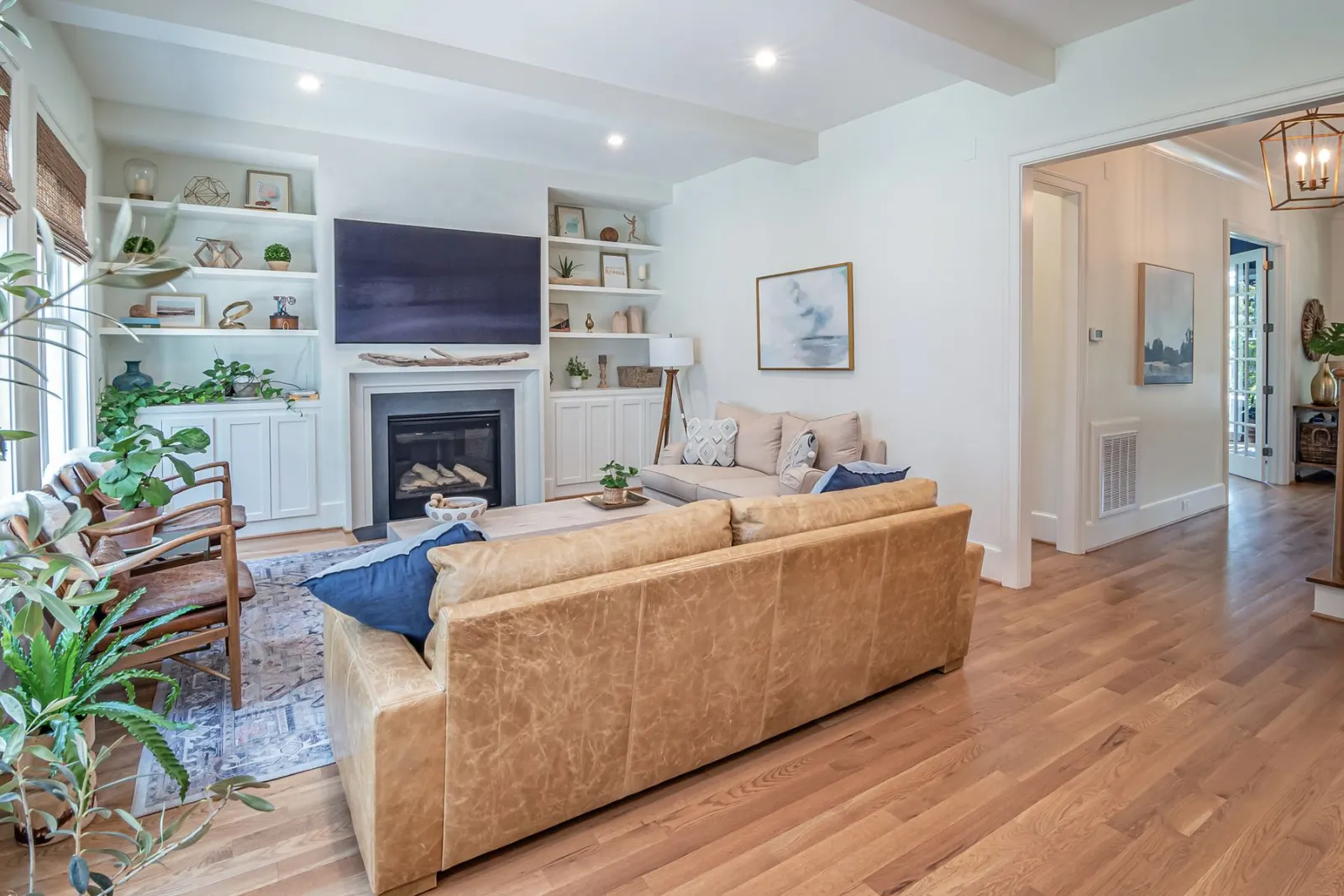 A room with built-in shelving fitted into the alcoves