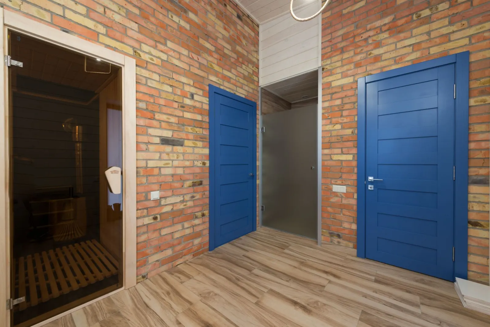 Panelled timber doors set into a brick opening
